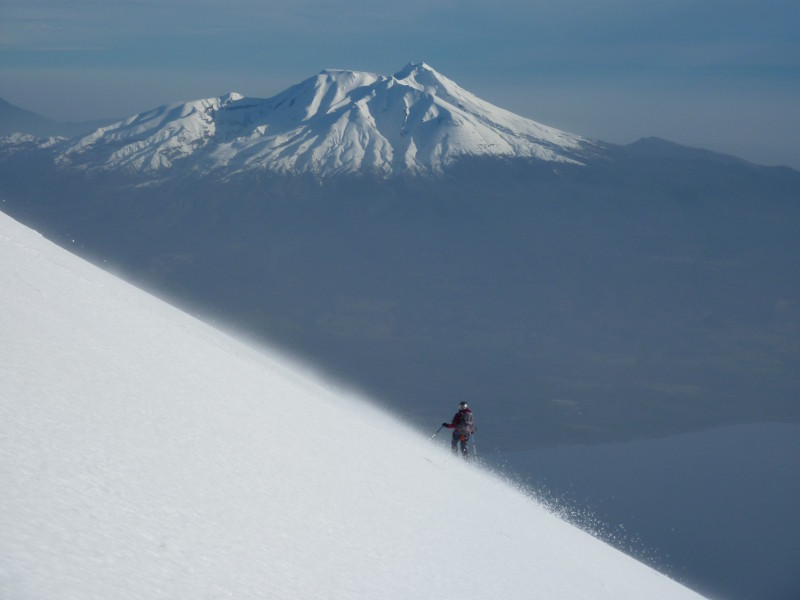 Descending Volcan Osorno, with Volcan Calbuco in the distance.